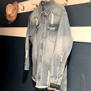 Woman’s jean jacket. Size medium. Hip length. Brand new and never worn